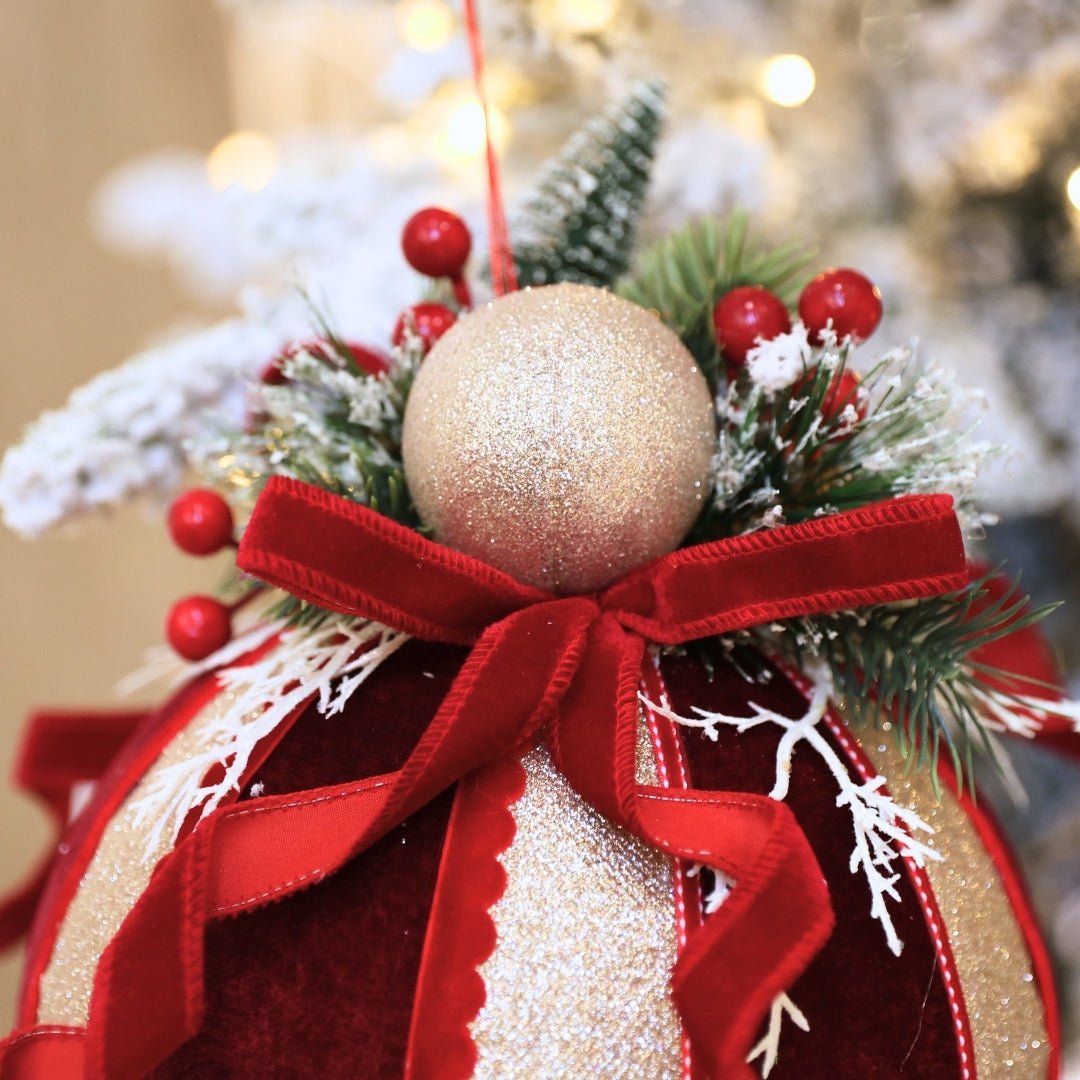 Burgundy & Champagne Ball Ornament With Bow & Foliage