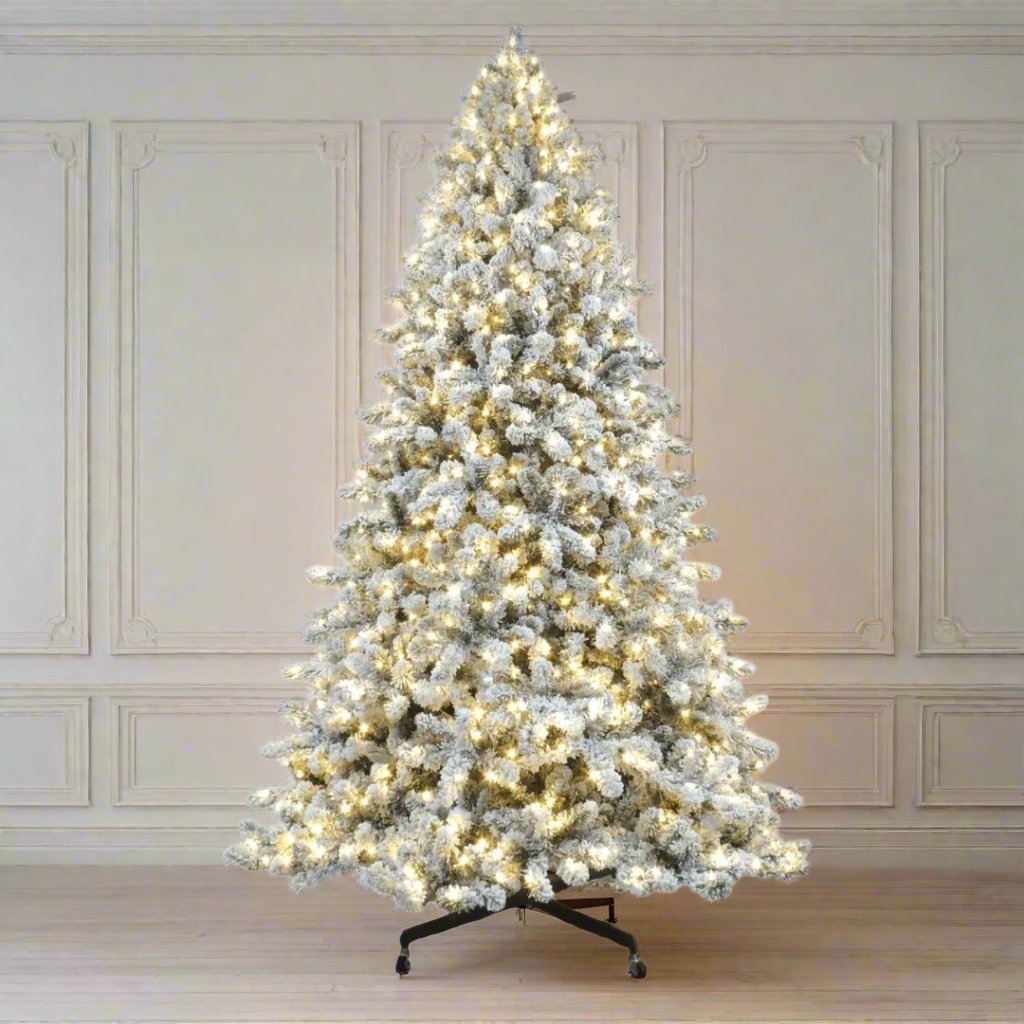 Joy By 8.5' Flocked Christmas tree with 900 Warm White LED Lights