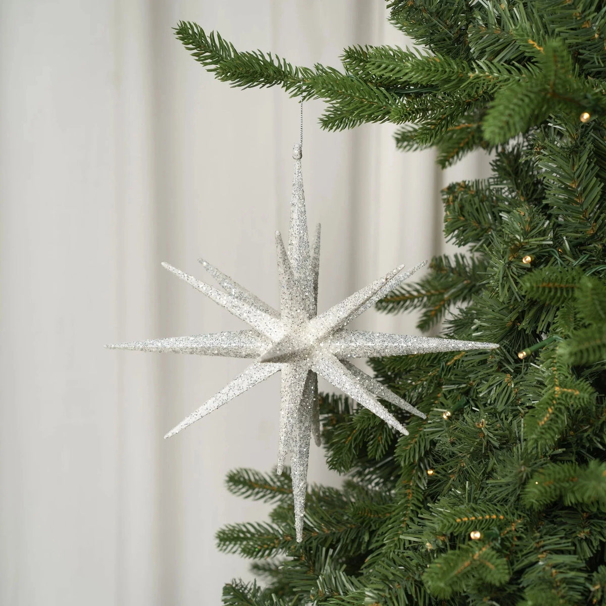 Silver 11-Point Star Ornament With White Glitter